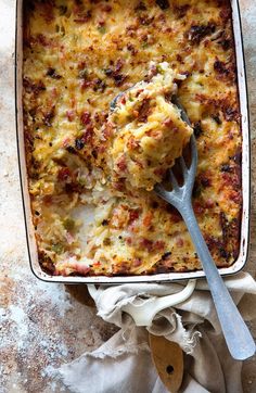 a casserole dish with meat and vegetables in it