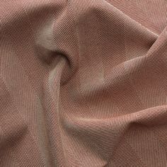 a close up view of a brown fabric with diagonal lines on the top and bottom