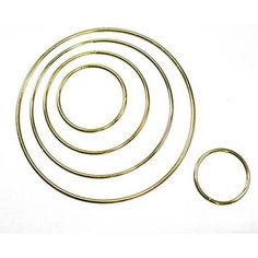 an assortment of metal rings and washers on a white background