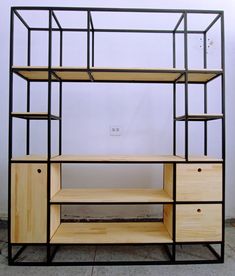 the shelf is made out of wood and metal with shelving units on each side