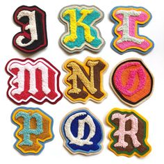 the letters are made out of felt and sequins