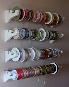 there are many different colors of ribbons on the wall