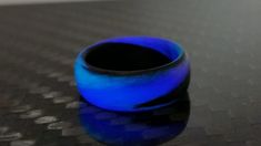 * THE RING - This particular ring boasts a traditional round band, slight comfort fit and a matte finish. The matte finish is extremely durable with a purple and blue glow. A high gloss finish is optional, leave us a note on the order if you would like a gloss finish. Made with pure carbon fiber and composite for the glow. Since each ring is individually handcrafted, there might be slight differences in each ring giving you a one of a kind piece. * PROPRIETARY NASA TECHNOLOGY IN EVERY RING - Hav Nasa Technology, Glow Ring, Blue Glow, The Glow, High Gloss Finish, Resin Jewelry, Unique Rings, High Gloss, Nasa