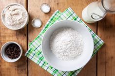 flour, chocolate chips and milk on a wooden table