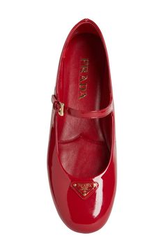 Prada's iconic triangular logo brands this ballet-inspired mary jane crafted of glossy calfskin leather in a fiery hue. Adjustable strap with buckle closure Leather upper and lining/rubber sole Made in Italy Designer Shoes Prada Ballet Flats, Prada Mary Jane, Gucci Outfit, Iconic Shoes, Designer Flats, Stunning Shoes, Design Shoes, Girly Shoes, Mary Jane Flats