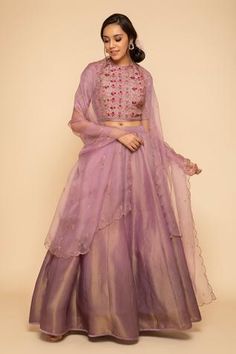 Plum blouse with all-over floral embroidery and round neck. Paired with lehenga and dupatta.
Component: 3
Embroidered
Neckline: Round
Sleeve Length: Half 
Fabric: Lehenga: Zari Tissue; Blouse: Silk
Color: Purple
Front hook closure
Sequin embellished dupatta
Scallop hem dupatta - Aza Fashions Tissue Lehenga Blouse Designs, Tissue Lehnga Design, Tissue Silk Lehenga Designs, Silk Tissue Lehenga, Tissue Fabric Lehenga, Tissue Lehanga Design, Tissue Lehenga Designs, Tissue Lehenga, Tissue Silk Lehenga