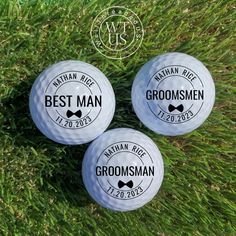 three groomsmen golf balls sitting on the grass with their names printed on them