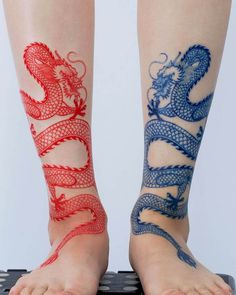 the legs are decorated with red, white and blue dragon tattoos on both sides of their ankles