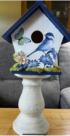 a bird house sitting on top of a table