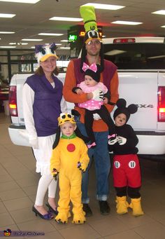 the family is dressed up in costumes for halloween