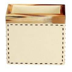 a white and brown leather box with a black stitching on the front, side view