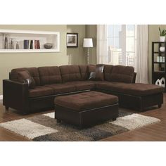 a living room with a sectional couch and ottoman