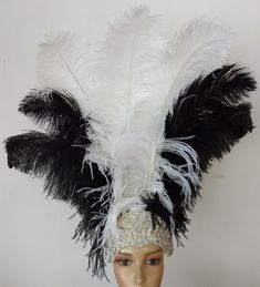 "We make and ship our items really fast if you need it for a specific date please let us know. or call/text us at 954-3051817 to complete your order over the phone Prime wing Ostrich Plumes Feathers Carnival Headdress Showgirl on a Crystal Rhinestone tiara/crown Headdress approximate height including crown is approx 22\" Prime quality Ostrich feathers in white and black Secured with a glitter elastic band A miamifeathers original All the items are new! Please Note regarding shipping: Even though Costume Party Hats With Ostrich Feathers, White Costume Hats And Headpieces For Carnival, Black Feathered Costume Hats And Headpieces, Fitted Feather Costume Hat, Costume Party Hat With Ostrich Feather Trim, Ostrich Feather Trim Hat For Costume Party, Carnival Headdress, Crown Headdress, Rhinestone Tiara