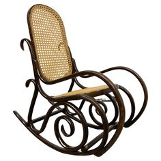 a wooden rocking chair with wicker seat and backrests on an isolated white background