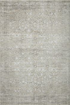 an area rug with grey and white colors