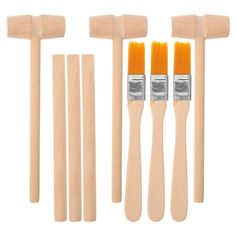 four paint brushes and five wooden dowels