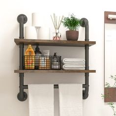 a bathroom shelf with towels, toiletries and other items