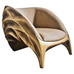 a gold colored chair sitting on top of a white floor