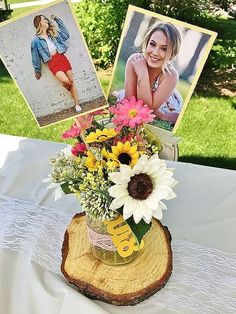 a vase filled with flowers sitting on top of a white tablecloth covered table cloth