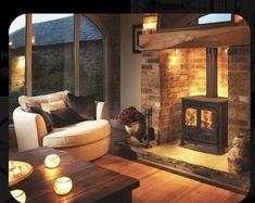 a living room filled with furniture and a fire place in front of a window next to a fireplace