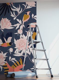 a ladder leaning against a floral wallpaper with birds and flowers on it, next to a steplader