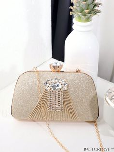 BagForLove - Rhinestone Mini Box Bag: Elegant Bride Purse for Weddings, Proms, and Parties Product Description Color Gold Details Rhinestone Bag Size Mini Style Minimalist Pattern Type All Over Print Type Box Bag Closure Type Kiss Lock Material Aluminum Alloy Size Chart INCH CM Bag Height Bag Length Bag Width Handle Height Strap Length 4.7 inch 7.9 inch 2 inch 4.3 inch 47.2 inch Bag Height Bag Length Bag Width Handle Height Strap Length 12 cm 20 cm 5 cm 11 cm 120 cm Details Pictures Similar Products h2 { text-align: center; } /* æ¢è¡ */ li{ white-space: normal; word-break: break-all; word-wrap: break-word; } .red-box { width: 100%; display: flex; flex-direction: row; flex-wrap: wrap; justify-content: center; } .red-box > div { width: 190px; height: 250px; margin: 10px; } .red-box > div > Gold Crystal Bags For Prom, Sparkling Crystal Evening Bag For Wedding, Gold Crystal Evening Bag For Wedding, Gold Rhinestone Evening Bag For Prom, Gold Crystal Evening Bag For Prom, Gold Crystal-embellished Evening Bag For Prom, Gold Rhinestone Clutch For Prom, Sparkling Clutch Evening Bag For Wedding, Gold Bling Bags For Wedding