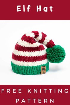 a red and white knitted hat with green pom - pom