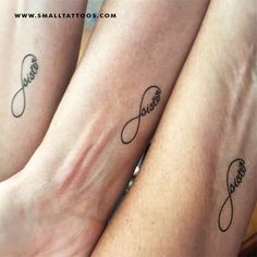 two people with matching tattoos on their legs, one is holding the other's hand