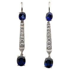 Dangly Sweetness These lovely long drop earrings are 1940/45 ca Still Art deco influenced, finely hand crafted as unique of solid 18 KT white gold Simple effective style to be with you all the time and at any occasion Long and eye catching on ears with lot of swing at any movement Set with natural untreated Blue Sapphire round cut over the top and oval cut as final drop – approx 2.0 Ct in total beautiful electric Blue Interspaced by a line of round cut Diamonds and a particular trillion cut Diam Still Art, Long Drop Earrings, Natural Blue Sapphire, Natural Sapphire, Vintage Diamond, Round Cut Diamond, Ear Piercings, Sapphire Ring, Blue Sapphire