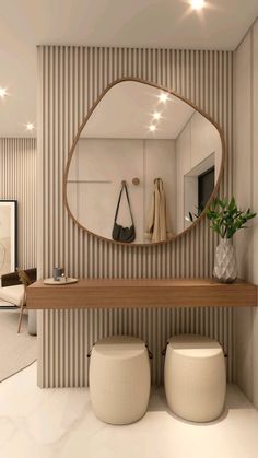 there is a mirror and stools in this bathroom with beige stripes on the wall