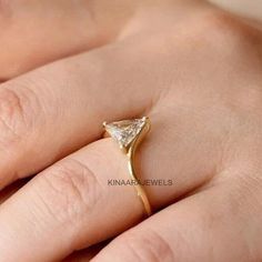 Triangle Moissanite Ring * Triangle Diamond Ring * Solid Gold * Dainty Diamond Ring ● 𝐃𝐢𝐚𝐦𝐨𝐧𝐝 𝐃𝐞𝐭𝐚𝐢𝐥𝐬 > Stone type: Moissanite / Simulated Diamond > Center Stone Shape: Triangle Cut > Weight: 1.00 CT > Stone Color: Colorless > Main Stone Clarity: VVS1 > Cut Grade: Excellent ❤ More Of My Engagement Ring ❤  https://www.etsy.com/shop/kinaarajewels ●  Kinaarajewels Services/Notes  A. Handmade Customized Jewelry. B. More than 50+ Antique and Fancy Cuts and Shapes of Moissanite Diamonds. Ring With Triangle Stone, Promise Diamond Ring With Trillion Cut, Trillion Cut Gold Promise Ring, Diamond Ring With Vs Clarity And Trillion Cut, Promise Ring With Trillion Cut And Prong Setting, Trillion Cut Diamond Ring Vs Clarity, Trillion Cut Diamond Ring With Vs Clarity For Promise, Trillion Cut Vs Clarity Diamond Promise Ring, Diamond White Trillion Cut Solitaire Jewelry