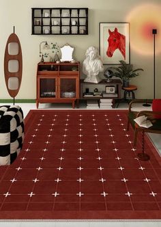 a living room with red rugs and pictures on the wall above it's coffee table