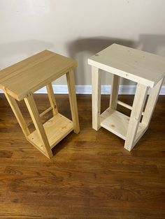 two small wooden tables sitting on top of a hard wood floor