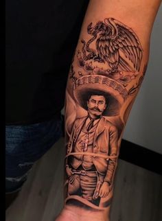 a man with a mexican tattoo on his arm