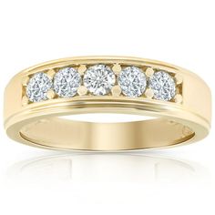 a yellow gold ring with five diamonds