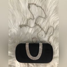 One Black And Faux Silver Clutch Purse/Handbag. Felt-Like Material. Rhinestone Detail. Finger Loop. Includes A Faux Silver Chain To Make Into A Crossbody Purse. See Pics For Sizing. No Inside Pockets. Meant For A Number Of Small Items Such As Keys, Wallet And Phone. New/Never Used. Have A Great Day! Silver Bling Bags For Night Out, Silver Evening Bag With Bling For Night Out, Elegant Bags With Silver-tone Hardware For Night Out, Elegant Night Out Bag With Silver-tone Hardware, Elegant Bags For Night Out With Silver-tone Hardware, Elegant Evening Bag With Silver-tone Hardware For Night Out, Elegant Evening Bag With Silver-tone Hardware, Black Evening Bag With Silver-tone Hardware For Party, Silver Evening Bag With Rhinestone Fringe