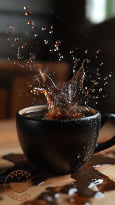 a coffee cup with water splashing out of it