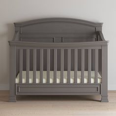 a baby crib in a room with white walls