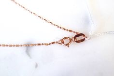 Metal: 14kt Rose Gold Stone: Diamond Stone Shape: Round Diamond Weight: .18 carats, each stone is approximately 1.30mm Weight of entire piece with chain: 2.20 grams Type of chain: 1mm Alternating Diamond-Cut Bead Chain. Other chains available. Type of Closer: Lobster Clasp Length of Necklace: 16 Inches. Other lengths available. Height Of Cross Including Bail: 19.25mm Customization: This necklace can be made with any color 10k or 14k gold, as well as platinum. It can also be made with any gems of Rose Gold Link Necklace For Anniversary, Rose Gold Necklace With Spring Ring Clasp For Anniversary, Dainty Rose Gold Necklace With Figaro Chain, Delicate Rose Gold Box Chain Necklace, Anniversary Rose Gold Necklace With Spring Ring Clasp, Dainty Rose Gold Necklace With Box Chain, Minimalist Rose Gold Figaro Chain Jewelry, Minimalist Rose Gold Jewelry With Figaro Chain, Formal Rose Gold Jewelry With Figaro Chain