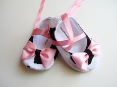 "This listing is for Moo Cow Baby Soft Ballerina Slippers. It has a pink bow embellishment & pink ribbon ties. This shoes are soft for those delicate baby or infant feet. The ribbon tie are long enough to wrap/tie around the ankle.  Match this shoes with this tutu set: http://www.etsy.com/listing/78499976/tutu-mootu-cow-pink-tutu-baby-toddler  For custom orders, please specify the size. You can use this table for rough measurements:  0-3 months: 4\" 3-6 months: 4.25\" 6-9 months: 4.5\" 9-12 months: 4.75\" 12-18 months: 5\" For shoes sizing: measure your child feet from heel to tip of big toe in inches and order the next size up to make sure it fits. Our shoes measures small and the inches equivalent is the measurement  outside not the inside. If you prefer exact sizing on your babies feet, Cute Booties For First Birthday In Spring, Cute Pink Booties For First Birthday, Cute Pink First Birthday Booties, Cute Pink Booties With Soft Sole, Cute Soft Sole Booties As Gift, Cute Pink Booties For Gift, Cute Pink Booties As Gift, Cute Closed Toe Booties For First Birthday, Cute Closed Toe Booties For Playtime