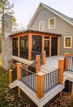 a house that has some stairs leading up to the front door and back porch area