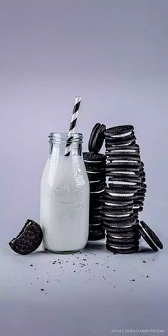 cookies and milk are stacked on top of each other with one cookie in the middle