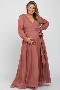 A plus size maternity dress perfect for stylish moms-to-be!  A chiffon maternity plus size maxi dress featuring metallic yarn, a wrap front v-neckline, long sleeves with a three gold button closure a self tie sash, and double lined at the bust and skirt. The Pink Metallic Chiffon Maternity Plus Maxi Dress is perfectly bump-friendly! Plus Maxi Dress, Lace Maternity Gown, Maternity Plus Size, Plus Size Maternity Dresses, Plus Size Maternity, Writing Projects, Maternity Dresses Summer, Plus Size Maxi Dress, Metallic Yarn