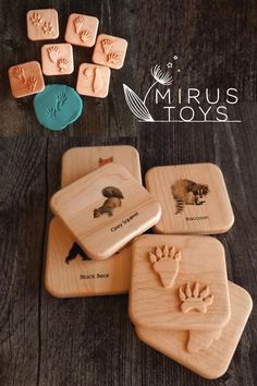 four wooden coasters with hand prints on them and the words, mrus toys