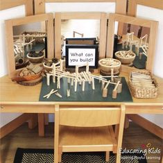 a wooden table topped with lots of different types of items on top of each other