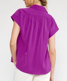 This lightweight top features a collared neckline, button down detail, short sleeves and permanent rolled cuffs. Easy to style for work or play, this top is versatile, comfortable and chic. 100% polyester Unlined, woven, non-sheer, lightweight Model is wearing a size small and is 5'10" Summer Collared Blouse For Work, Solid Short Sleeve Blouse For Business Casual, Collared Blouse For Summer Workwear, Solid Blouse With Rolled Sleeves For Work, Solid Workwear Blouse With Rolled Sleeves, Classic Short Sleeve Rayon Tops, Collared Short Sleeve Shirt For Summer Office Wear, Solid Collared Short Sleeve Shirt For Work, Summer Workwear Short Sleeve Shirt With Lapel Collar