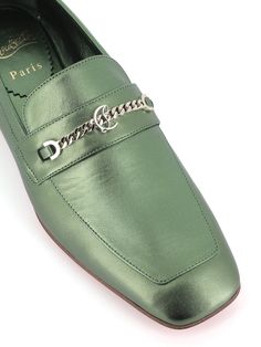 Metallic green leather Loafer by Christian Louboutin, featuring by a square toe and silver chain with CL monogram. Lined interior. Leather sole. Heel: 1,5 cmComposition: Leather Elegant Green Loafers For Business, Elegant Green Loafers For Formal Occasions, Elegant Green Formal Loafers, Luxury Green Loafers For Work, Luxury Green Loafers For Formal Occasions, Luxury Green Loafers For Business, Luxury Green Loafers For Office, Luxury Silver Loafers For Business, Luxury Green Loafers