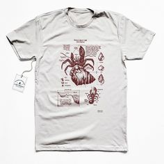 a white t - shirt with an image of a spider on it