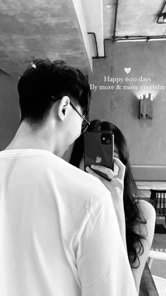 a man and woman taking a selfie in front of a mirror with the caption happy valentine's day