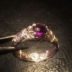 This is a handmade sterling silver ring with a deep purple Amethyst on a prong setting. Notice the detail and unique quality in the wrapped band. If your searching for a unique ring, you've found it!  The ring(s) pictured is for illustration purposes to give you an idea of how your ring will look. Each ring is handmade using natural pearls, thus having a unique quality of its own.  Thickness and shape of the pearl or width of the band may slightly vary. Checkout my shop policies to include jewelry care and shipping: https://www.etsy.com/your/shops/angieww/policies FAQ Q). Can I get this order in a different size not listed? A). US sizes 3-15 are available. If there is no option for US size 3-15, just send a note at checkout indicating the size needed. However, if you need a size other than Purple Ruby Ring In Sterling Silver For Promise, Sterling Silver Purple Ruby Ring For Promise, Purple Ruby Ring With Prong Setting As Gift, Anniversary Purple Ruby Ring In Sterling Silver, Unique Amethyst Promise Ring, Unique Purple Sterling Silver Crystal Ring, Handmade Amethyst Sterling Silver Ring For Anniversary, Handmade Sterling Silver Amethyst Ring For Anniversary, Handmade Elegant Amethyst Crystal Ring